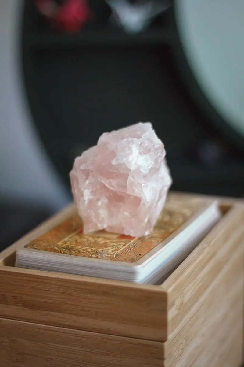 rose quartz on brown wooden table